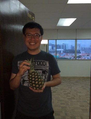 The chinese traditional of bringing a "Ong Lai" (pineapple) to the new office. Pineapple in hokkien means wealth come.
