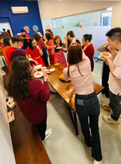 Everybody Enjoying A Taste Of The Fresh Yu Sheng