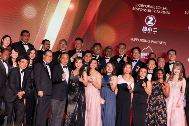 A close-up candid shot of current and past Board of Governors members